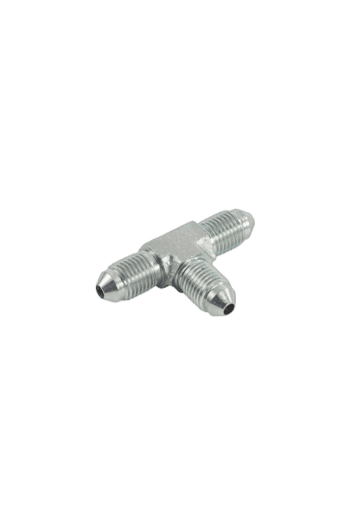 Close-up of a silver T-shaped racing car part, likely a connector or valve, used in motorsport engineering.