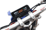 Electric motorcycle handlebar with digital display showing speed and battery status, part of Grand Prix Racewear's racing gear.