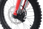 Close-up of a mountain bike front wheel with disc brake and suspension fork, showcasing high-performance cycling components.