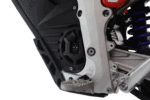 Close-up of a snowmobile's engine and chassis, showcasing high-performance racing components and sleek design.