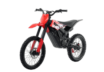 Electric dirt bike with red front fender and black frame, suitable for off-road racing and motocross enthusiasts.
