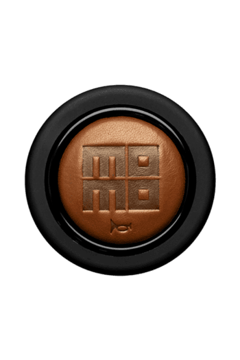 Close-up of a brown racing helmet with a black visor and a logo featuring a stylised 'M' and 'E' on the front.