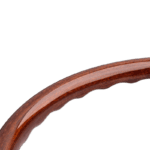 Close-up of a wooden steering wheel rim used in race cars, showcasing craftsmanship and high-quality materials for Grand Prix racing.