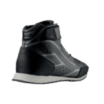 High-performance Grand Prix racing shoe designed for safety and speed, featuring a sleek black design with advanced grip and support for motorsport enthusiasts.