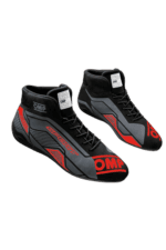 High-performance OMP Grand Prix Racewear racing shoes in black, red, and grey with racing branding, designed for motorsport enthusiasts and professional drivers.