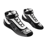 Black and white Grand Prix racing shoes with OMP branding, designed for motorsport safety and performance.
