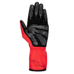 Black and red racing glove with white grip dots, designed for motorsport safety and performance.