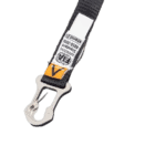 Close-up of a racing harness buckle with safety labels, used in Grand Prix racewear for driver safety.