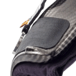 Close-up of a racing helmet with carbon fibre shell and black padding, showcasing high-quality Grand Prix Racewear gear.