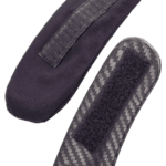 Close-up of racing shoe with Velcro strap and carbon fibre sole, designed for motorsport safety and performance.