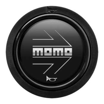 MOMO racing steering wheel button with black background and white logo, used in motorsport vehicles.