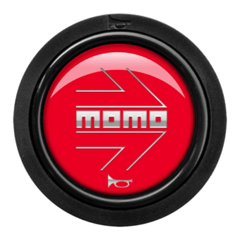 Momo racing steering wheel button with red background and white logo, used in motorsport vehicles.