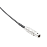 Close-up of a silver audio or video cable connector with a black cable against a black background.