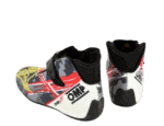 Child's racing shoes with a colourful design featuring red, yellow, black, and white, suitable for motorsport activities.