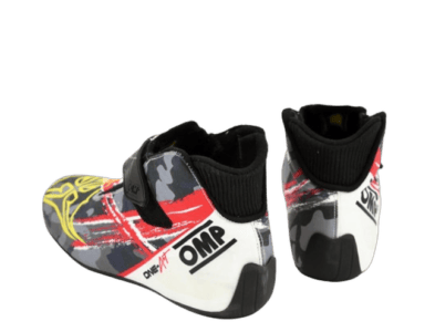 Child's racing shoes with a colourful design featuring red, yellow, black, and white, suitable for motorsport activities.