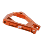 Orange Grand Prix racewear safety device with mounting holes, designed for motorsport safety equipment.