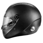 Black carbon fibre Grand Prix racing helmet with clear visor, designed for high-speed motorsport safety and performance.