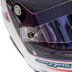 Close-up of a Grand Prix racing helmet with a tinted visor and branding details, highlighting safety and design features for motorsport enthusiasts.