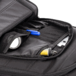 Close-up of a black racing helmet storage bag with racing accessories inside, suitable for Grand Prix racewear.