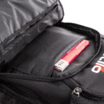 Grand Prix Racewear backpack with a racing helmet inside, showcasing professional racing gear for motorsport enthusiasts.