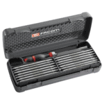 Facom multi-blade screwdriver set in a black plastic case with red and black handle tools, ideal for professional use.