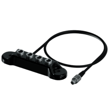 Motorcycle racewear sensor with cable for safety and performance monitoring at Grand Prix events.