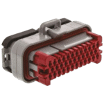 Close-up of a high-performance racing connector used in motorsport wiring systems, featuring red and grey components for secure electrical connections.