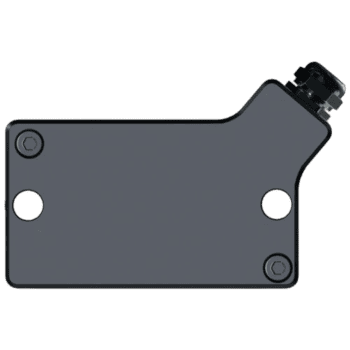 Close-up of a grey racing helmet communication device for Grand Prix racewear, designed for motorsport safety and communication.