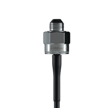 Close-up of a pressure sensor with a metallic body and black cable, used in racing car telemetry systems.
