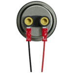 Close-up of a pressure sensor with two yellow connectors and red and black wires, used in automotive or industrial applications.