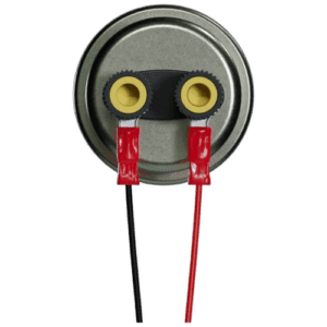 Close-up of a pressure sensor with two yellow connectors and red and black wires, used in automotive or industrial applications.