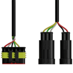 Close-up of electrical wiring connectors with multicoloured wires for automotive or racing applications.