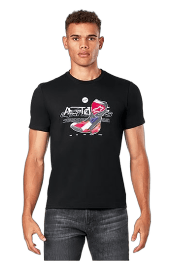 Young man wearing a black Grand Prix Racewear T-shirt with racing graphics, standing against a plain background.