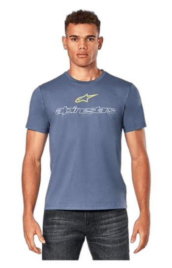 Young man wearing a blue Alpinestars racing T-shirt, standing confidently against a plain background.