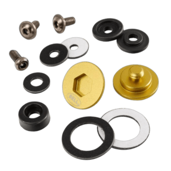 Set of racing hardware components including screws, washers, and a gold anodised bolt for Grand Prix Racewear applications.