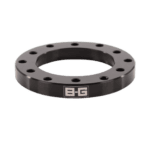 Black B-G Racing steering wheel spacer with multiple bolt holes for racing steering wheel installation.