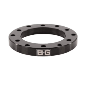 Black B-G Racing steering wheel spacer with multiple bolt holes for racing steering wheel installation.