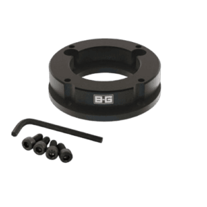 Black B-G racing part with four screws and an Allen key, designed for motorsport applications.