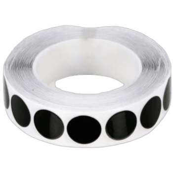 Black and white roll of racing tape used for motorsport safety and marking track boundaries.