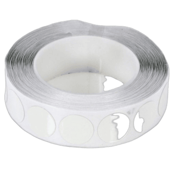 Roll of white racing tape with cut-out sections, used for Grand Prix racewear and motorsport safety gear.