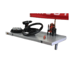 Race car steering wheel and racing simulator setup on a metal table with a red rear wing in the background.