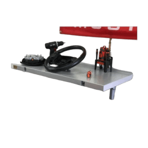 Race car steering wheel and racing simulator setup on a metal table with a red rear wing in the background.
