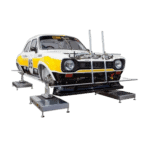 Classic racing car on a dynamometer for performance testing, featuring a white and yellow livery with racing number 85.