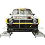 Classic race car on a testing platform with safety barriers, showcasing Grand Prix Racewear's motorsport apparel and equipment.