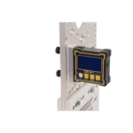 Close-up of a digital display device mounted on a metal plate, used in racing or industrial applications, with a black background.