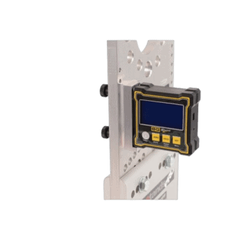 Close-up of a digital display device mounted on a metal plate, used in racing or industrial applications, with a black background.
