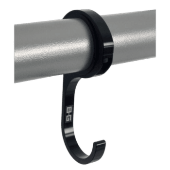 Black hook securing a silver pipe, designed for racewear or safety equipment, on a green background.