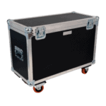 Heavy-duty black and silver flight case with caster wheels, used for transporting racing equipment or gear at Grand Prix events.