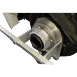 Close-up of a racing motorcycle's rear wheel and suspension system, showcasing high-performance components for motorsport racing.
