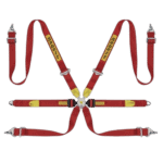 Grand Prix Racewear safety harness with red and yellow straps, used for motorsport safety and driver protection.